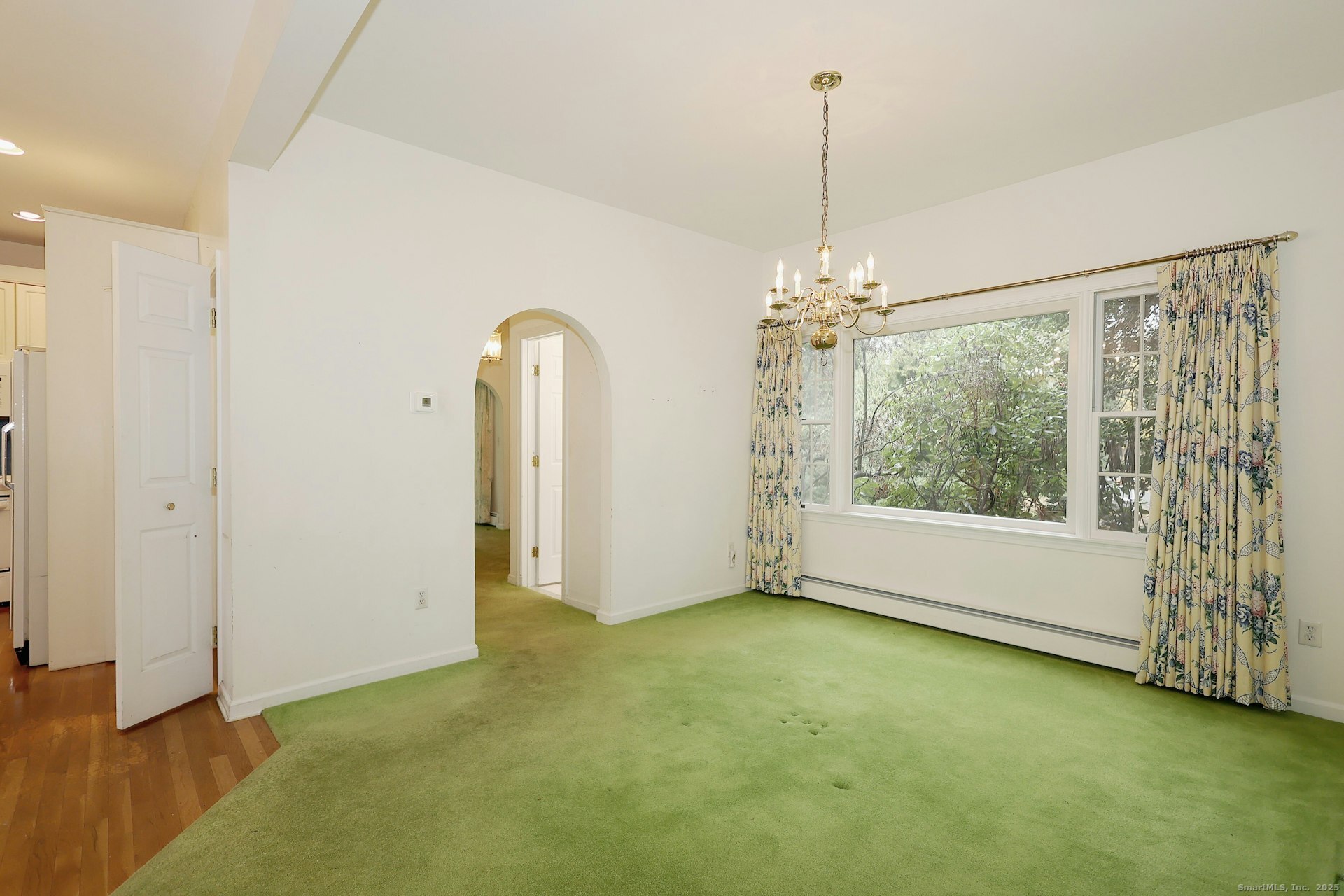 1213 Cedar Road Fairfield, CT 06890 - Photo 11 of 40 a view of a room with window wooden floor and front door