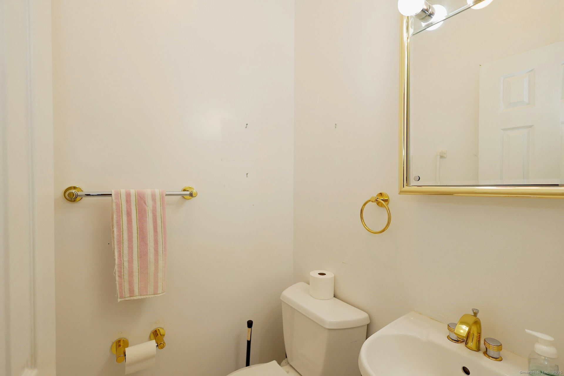 1213 Cedar Road Fairfield, CT 06890 - Photo 16 of 40 a bathroom with a toilet sink and shower