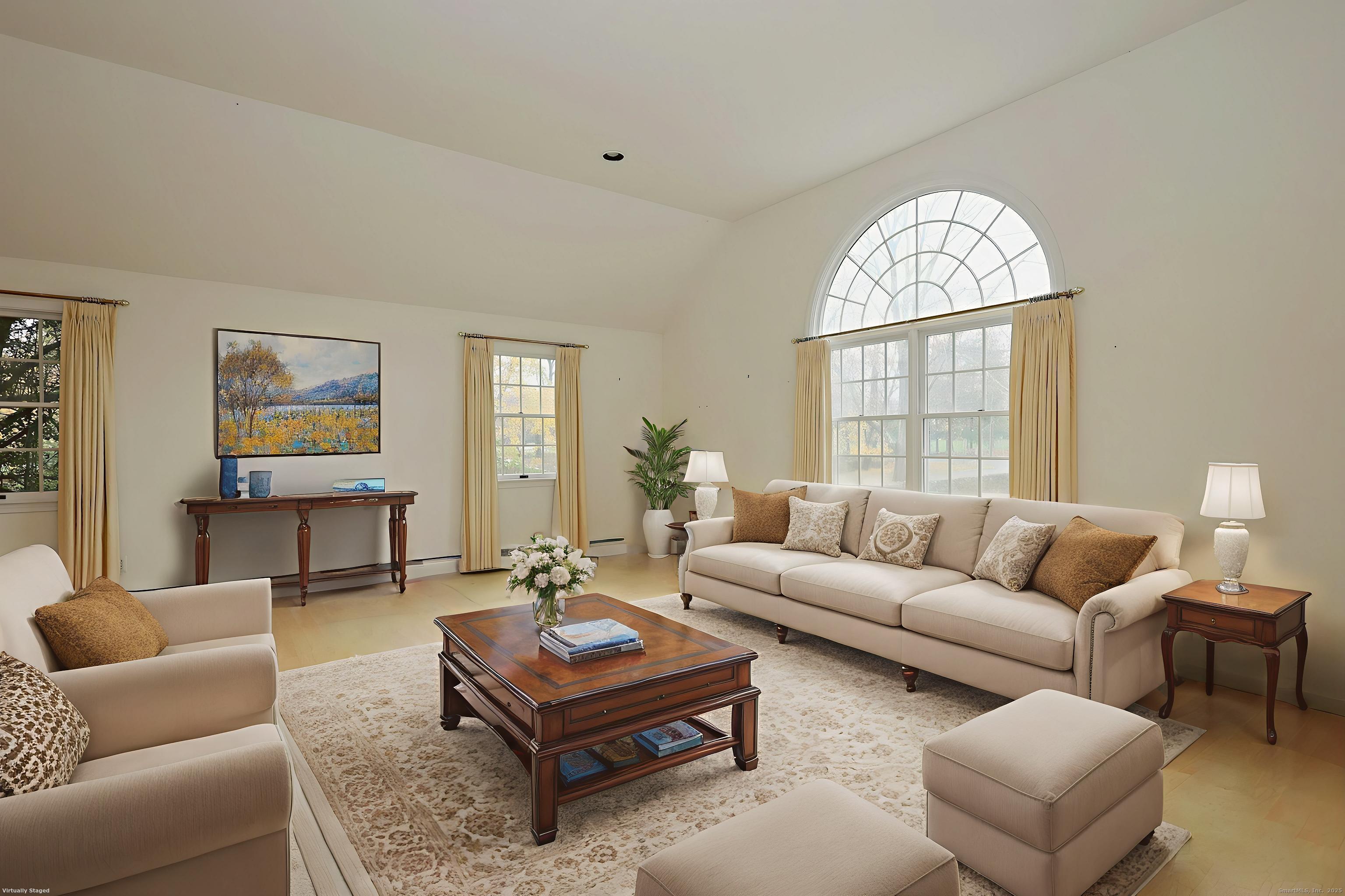 1213 Cedar Road Fairfield, CT 06890 - Photo 17 of 40 a living room with furniture a table and a window