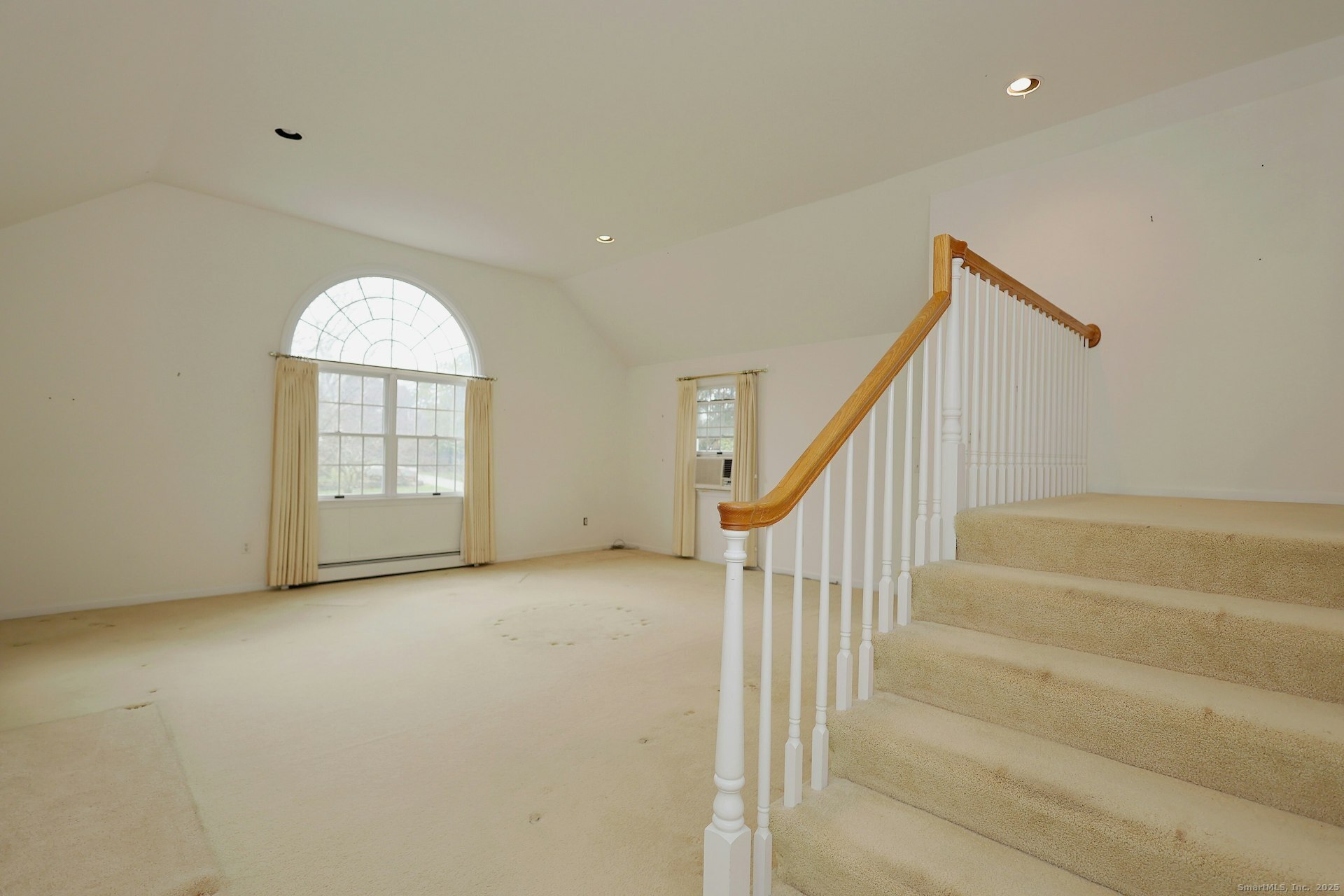 1213 Cedar Road Fairfield, CT 06890 - Photo 18 of 40 a view of an empty room with stairs