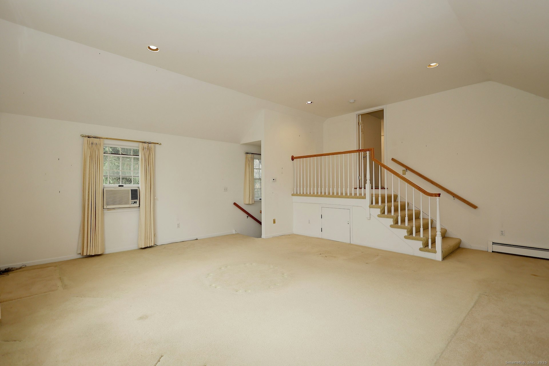 1213 Cedar Road Fairfield, CT 06890 - Photo 20 of 40 a view of an empty room with stairs