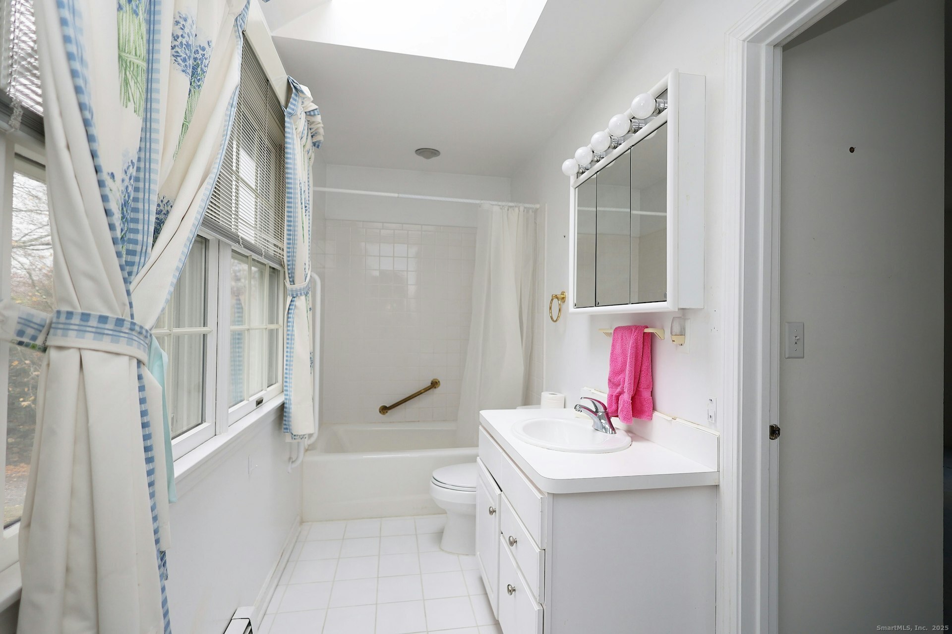 1213 Cedar Road Fairfield, CT 06890 - Photo 25 of 40 a bathroom with a sink and a mirror