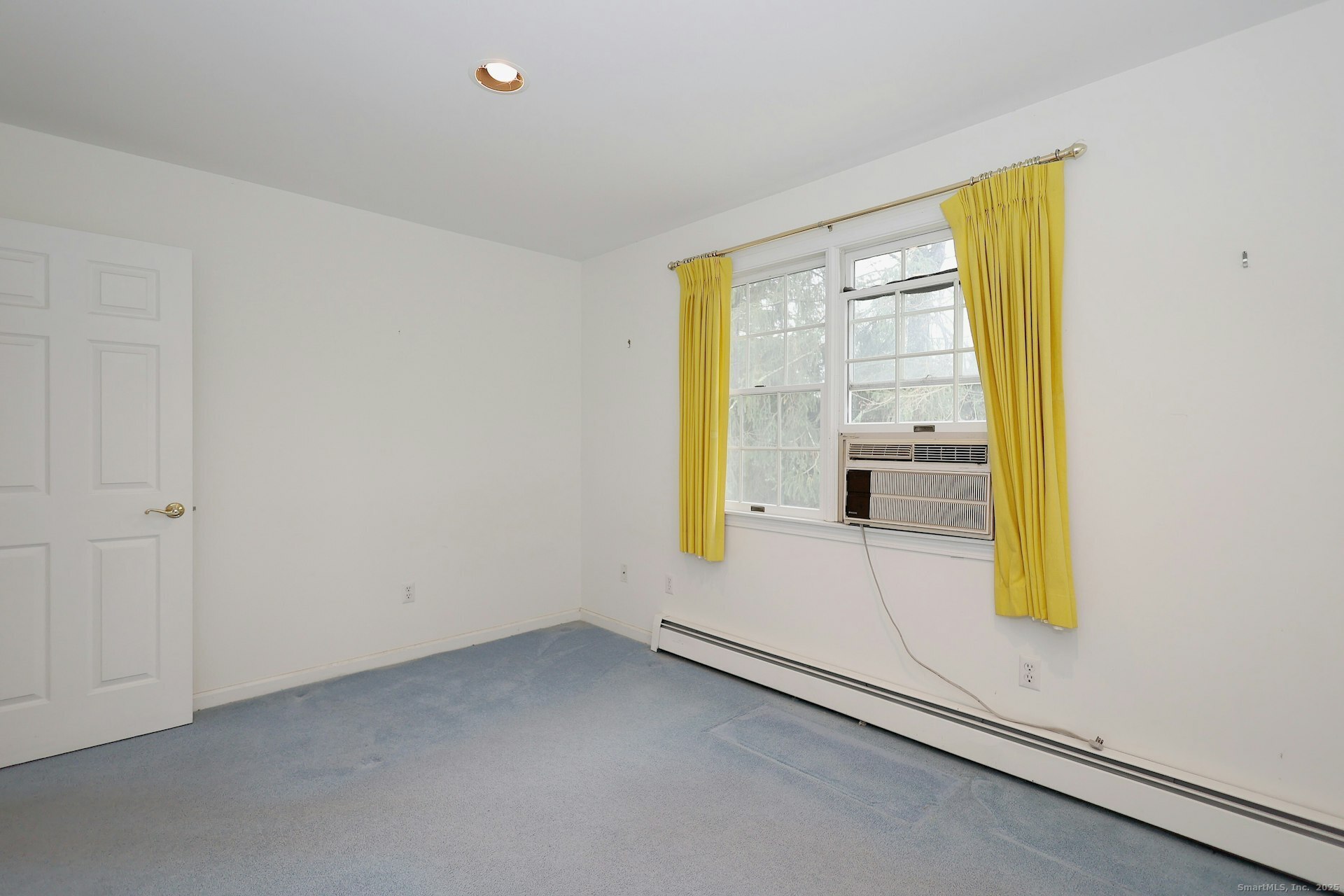 1213 Cedar Road Fairfield, CT 06890 - Photo 28 of 40 a view of an empty room with a window