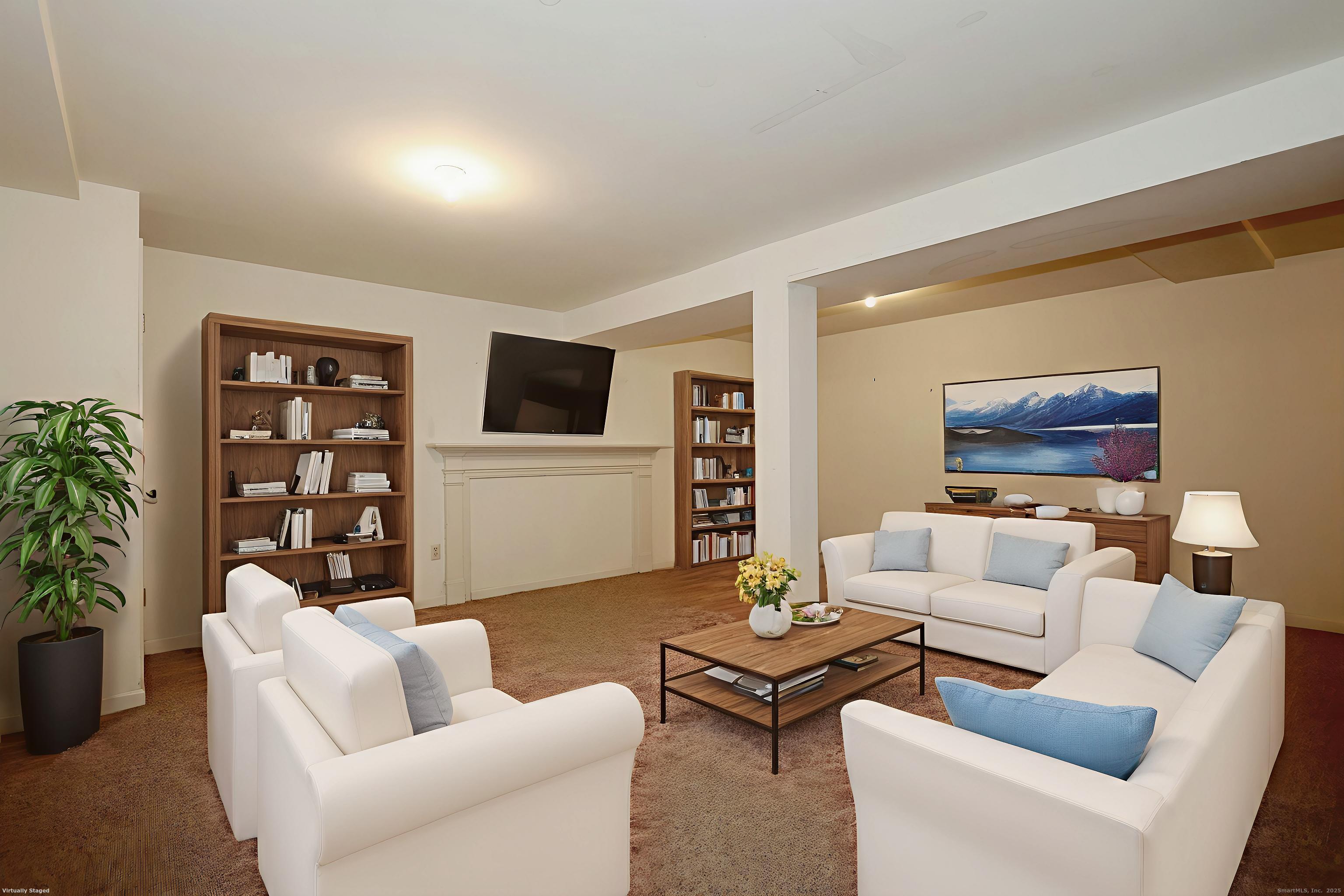 1213 Cedar Road Fairfield, CT 06890 - Photo 34 of 40 a living room with furniture and a flat screen tv