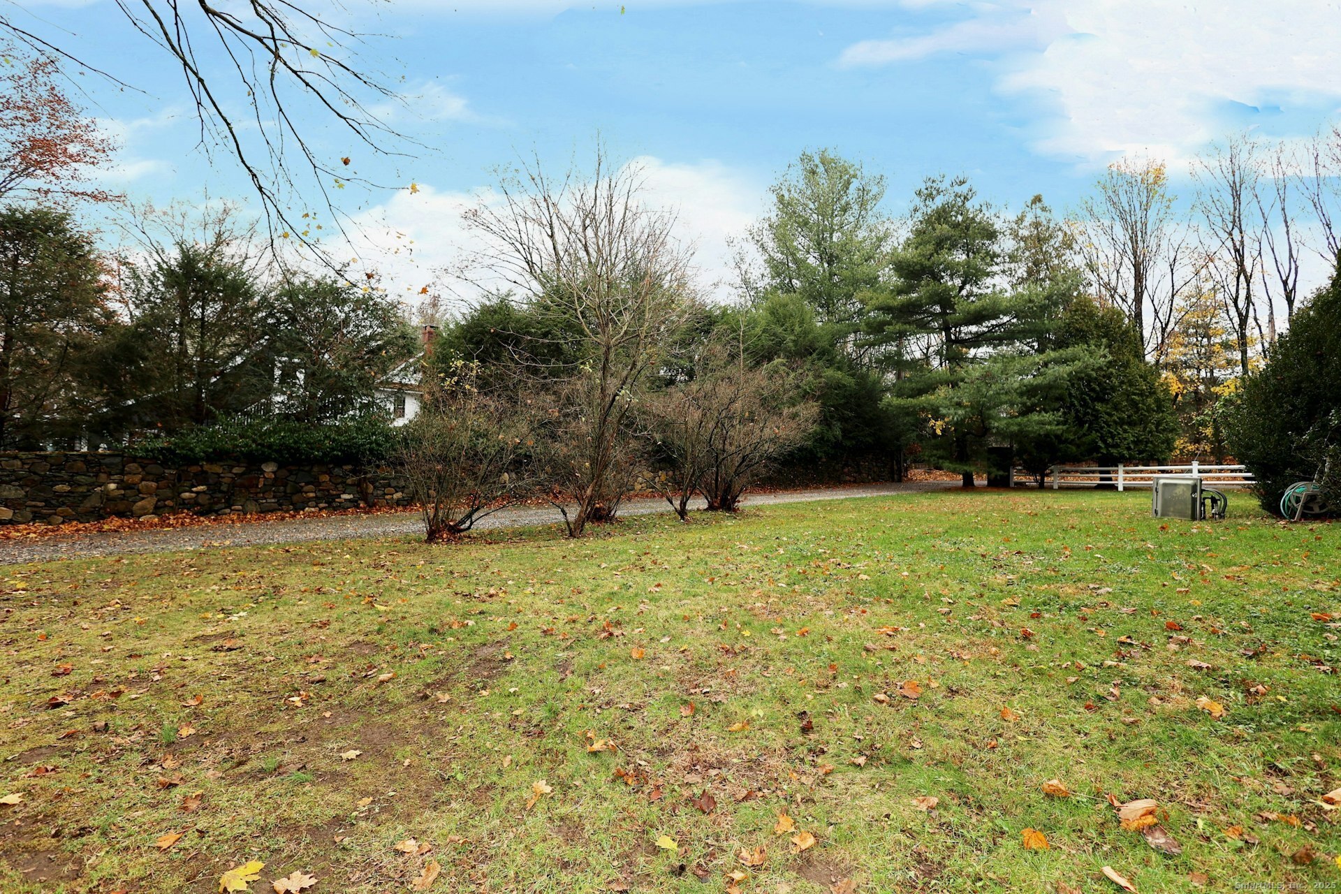 1213 Cedar Road Fairfield, CT 06890 - Photo 37 of 40 a backyard of a house with lots of green space