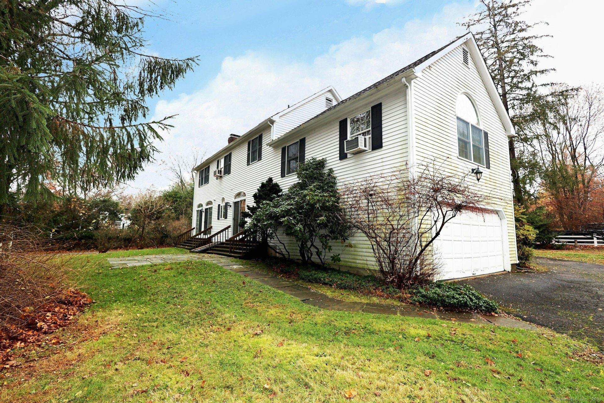 1213 Cedar Road Fairfield, CT 06890 - Photo 4 of 40 a view of a house with a yard