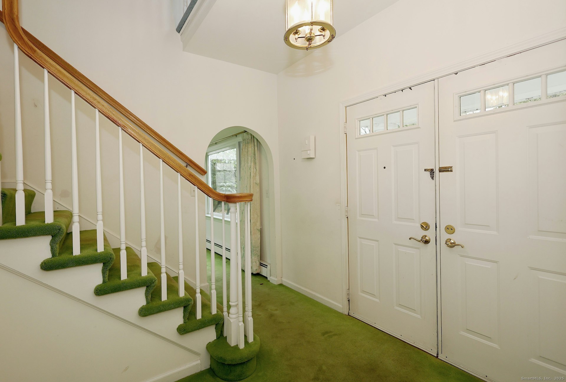 1213 Cedar Road Fairfield, CT 06890 - Photo 5 of 40 a view of an entryway with staircase