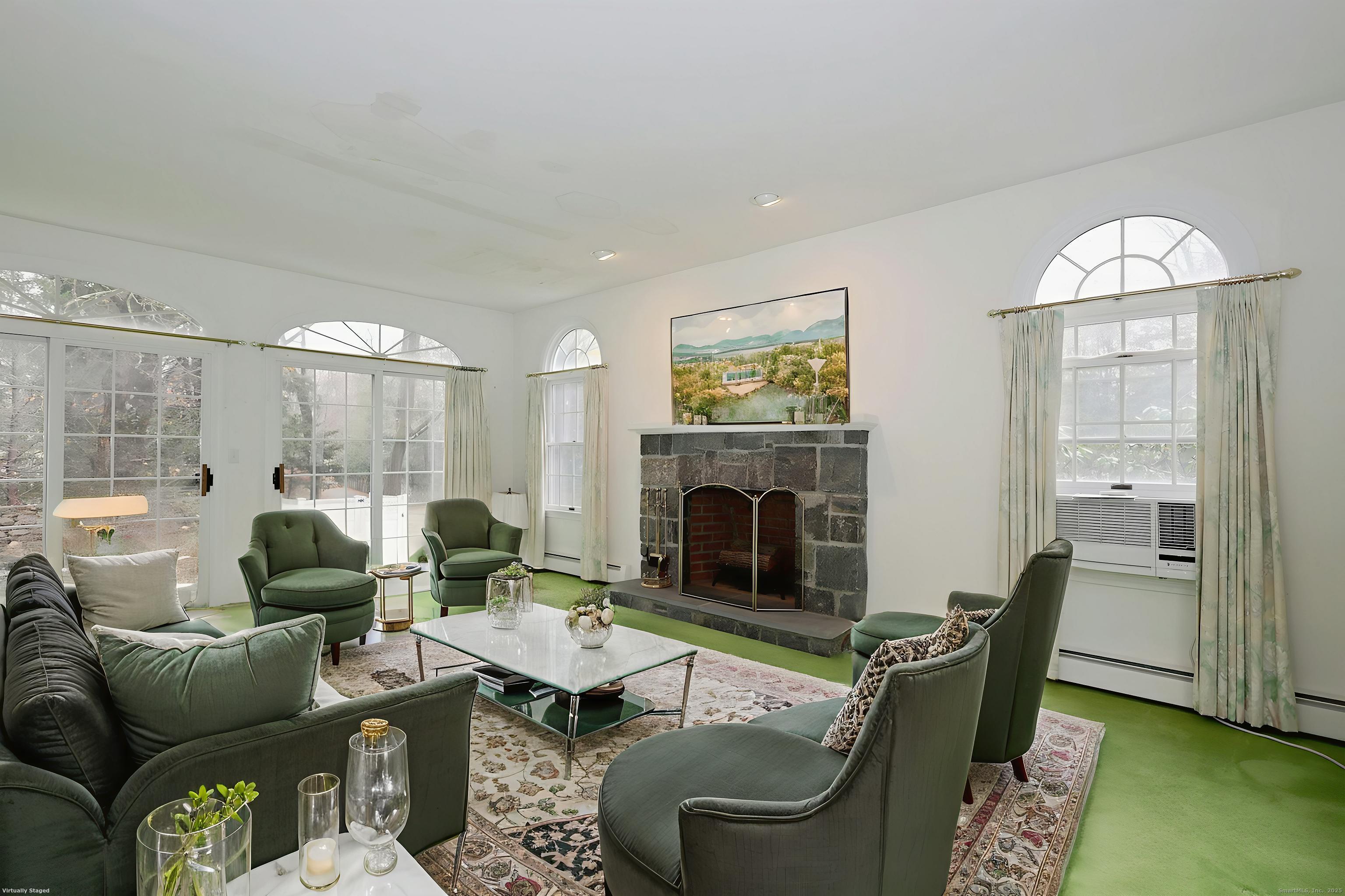 1213 Cedar Road Fairfield, CT 06890 - Photo 6 of 40 a living room with furniture and a fireplace