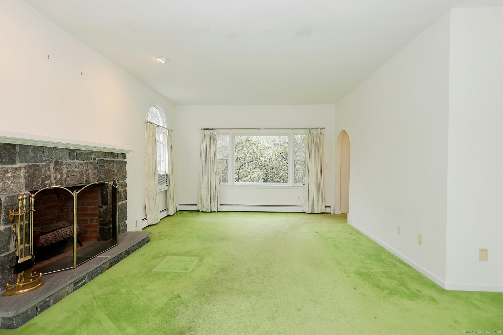 1213 Cedar Road Fairfield, CT 06890 - Photo 8 of 40 an empty room with fireplace and windows
