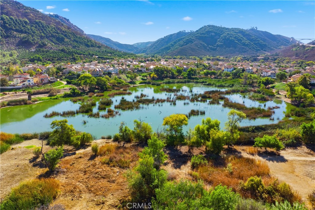 4875 Lake Shore Place Fallbrook, CA 92028 - Photo 27 of 31 a view of a lake with mountains in the background
