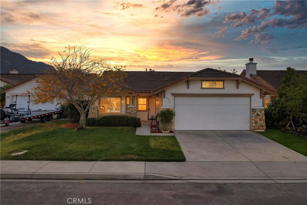 4875 Lake Shore Place Fallbrook, CA 92028 - Photo 31 of 31 a front view of a house with a yard and garage