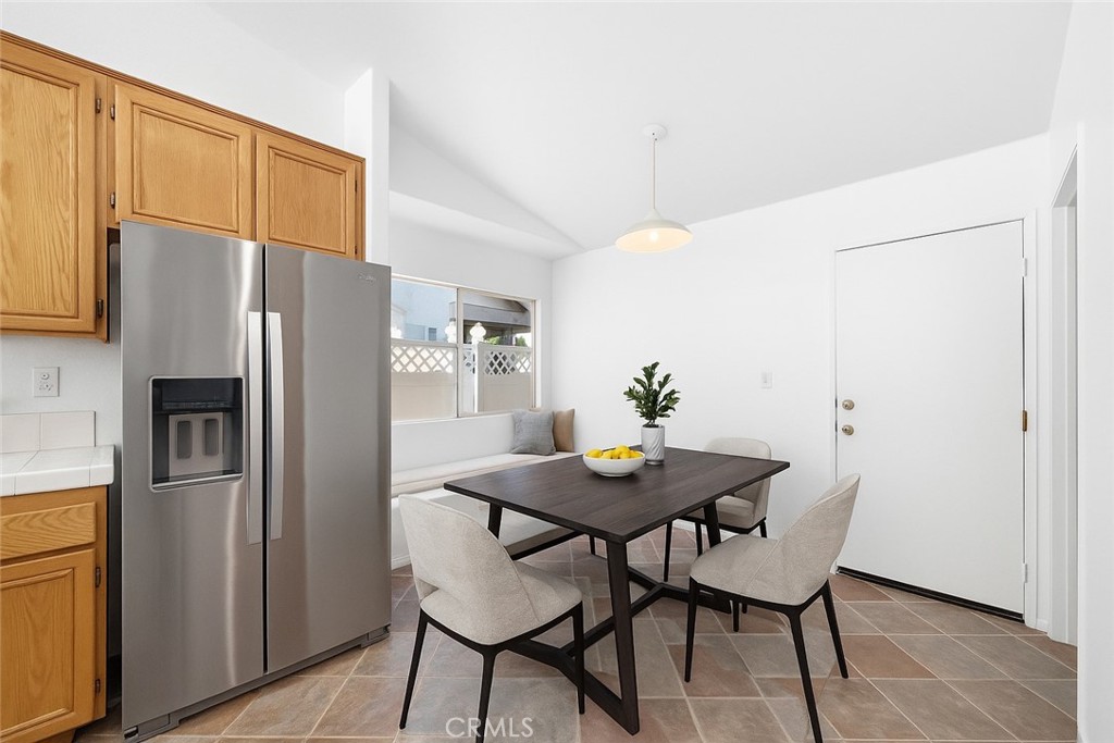 4875 Lake Shore Place Fallbrook, CA 92028 - Photo 10 of 31 a kitchen with stainless steel appliances a refrigerator and a table