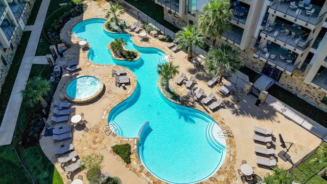 an aerial view of a house a swimming pool and outdoor space