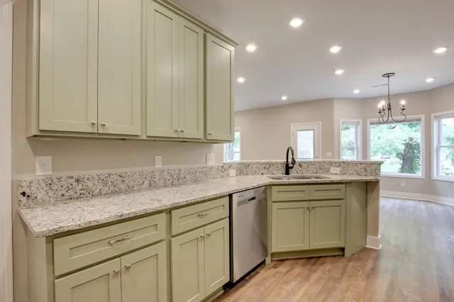 a view of a room with wooden floor