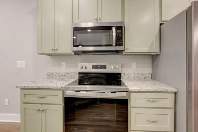 a view of a room with wooden floor and closet