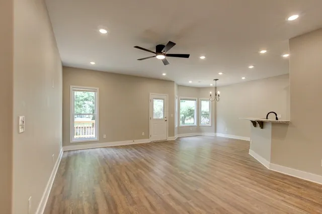 a view of a wooden deck and trees