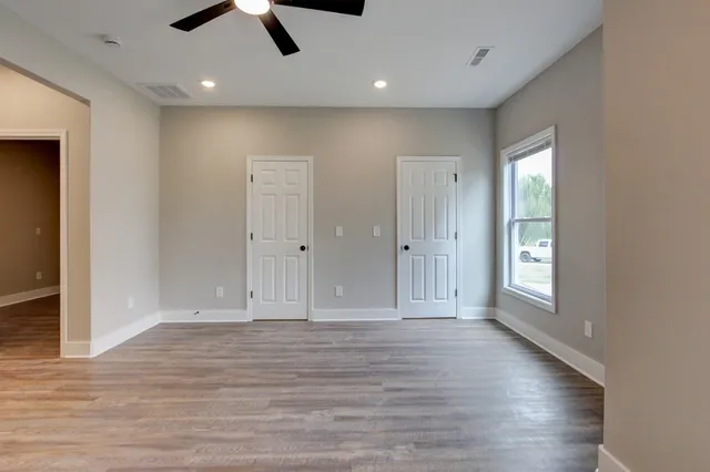 a view of a house with a yard and sitting area