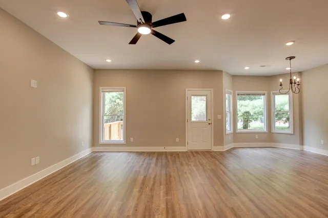 a view of room with window hardwood floor and windows