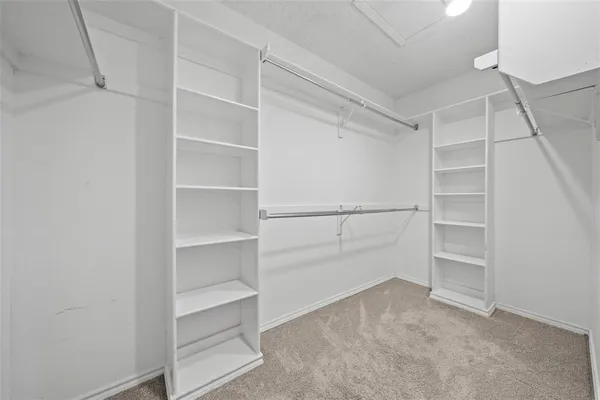 a view of an empty walk in closet