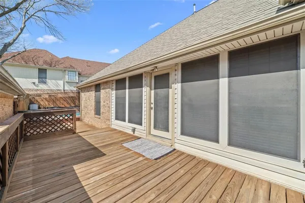 a view of a balcony with wooden floor