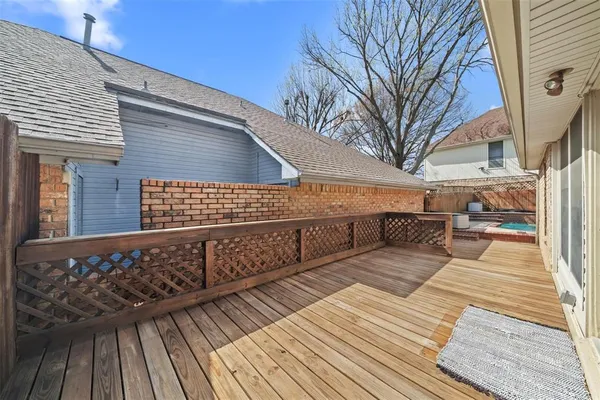 a view of a wooden deck with a bench