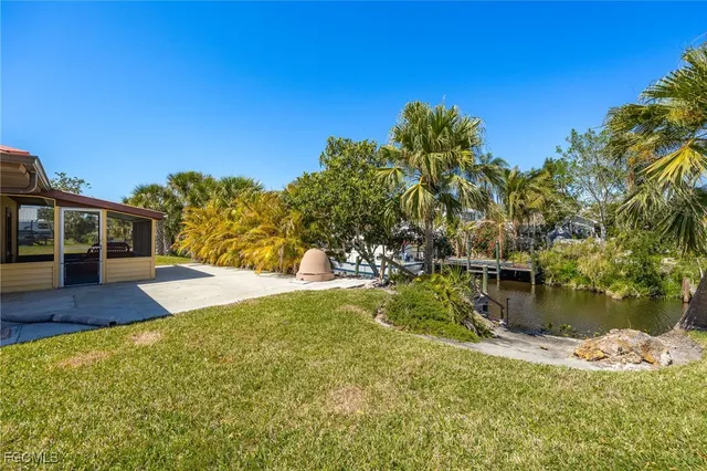 a view of swimming pool with a yard