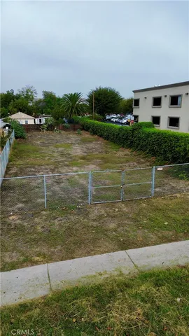 a view of a lake with houses in the back