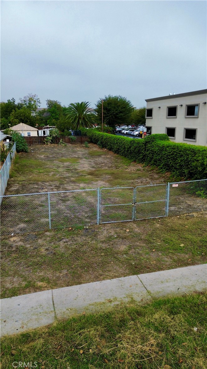 9959 Magnolia Avenue Riverside, CA 92503 - Photo 2 of 3 a view of a lake with houses in the back