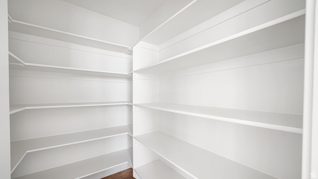 717 South Harrison Drive West Springville, UT 84663 - Photo 10 of 31 Walk-in pantry featuring white shelving, multiple storage levels, and corner shelving for optimized organization
