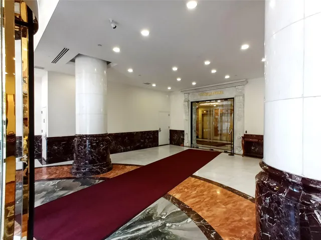 a lobby with furniture and window