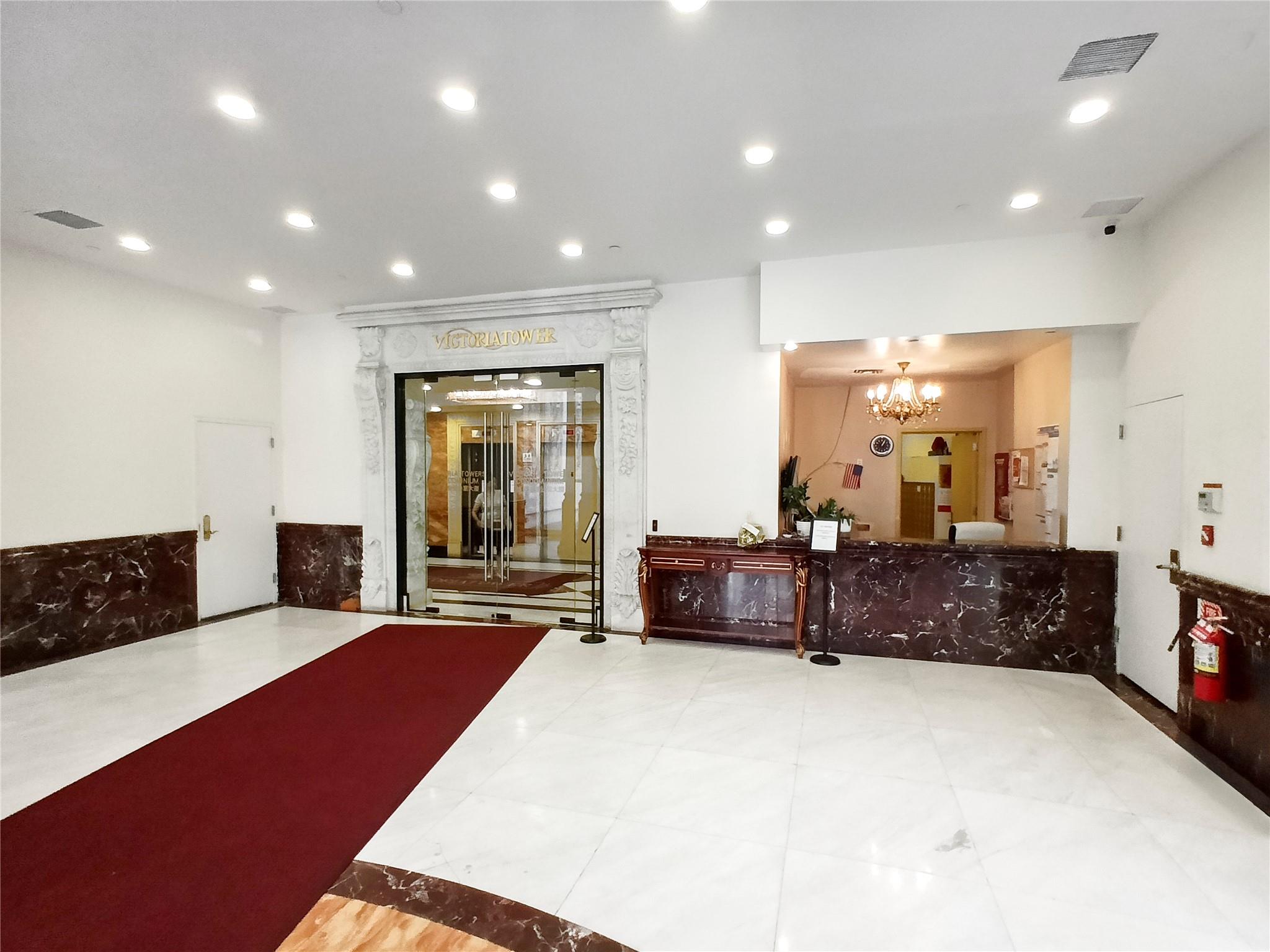 133-38 Sanford Avenue, Unit 6A Queens, NY 11355 - Photo 2 of 22 a living room with furniture a couch and large window