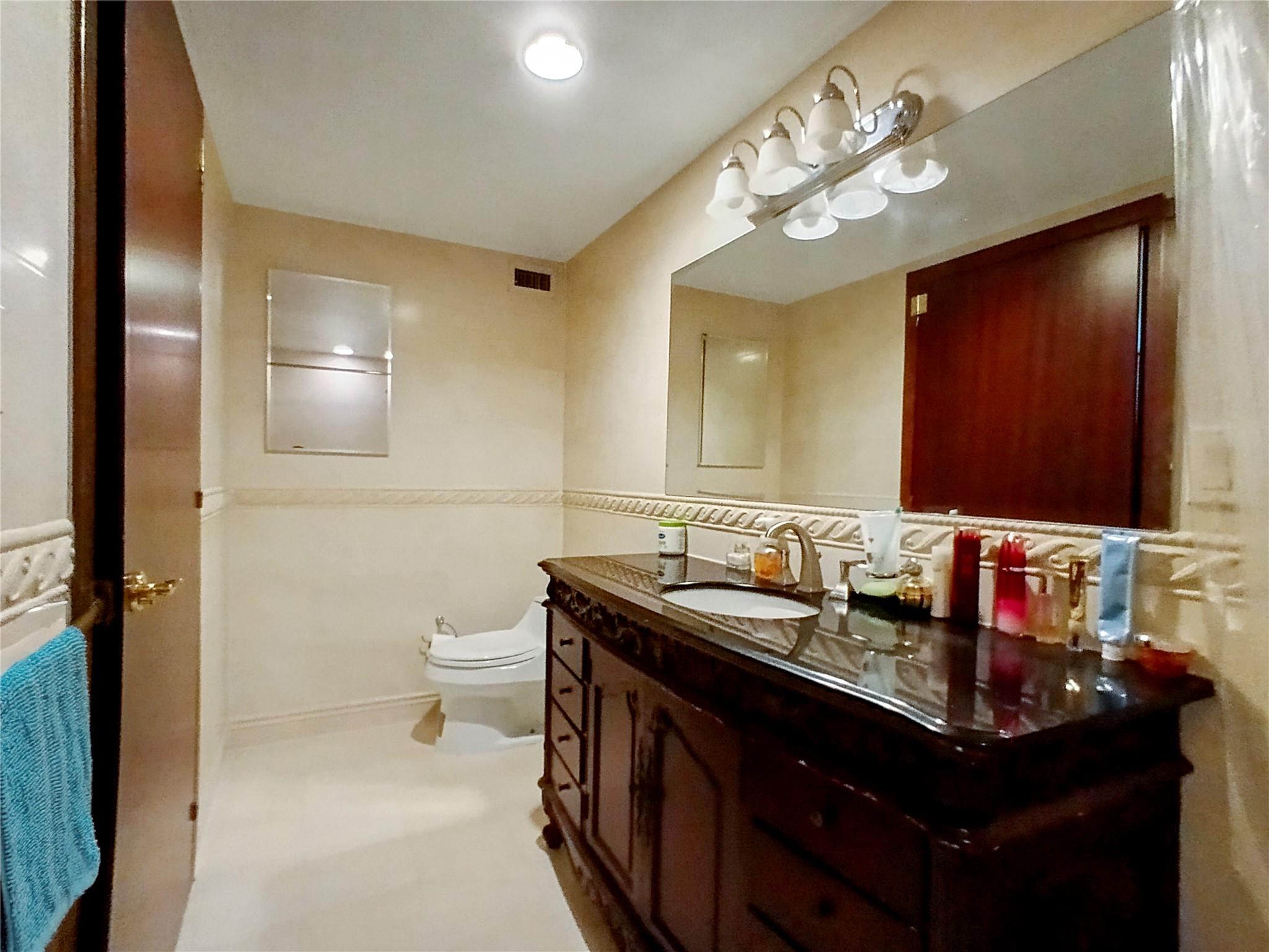 133-38 Sanford Avenue, Unit 6A Queens, NY 11355 - Photo 9 of 22 a bathroom with a sink and a mirror