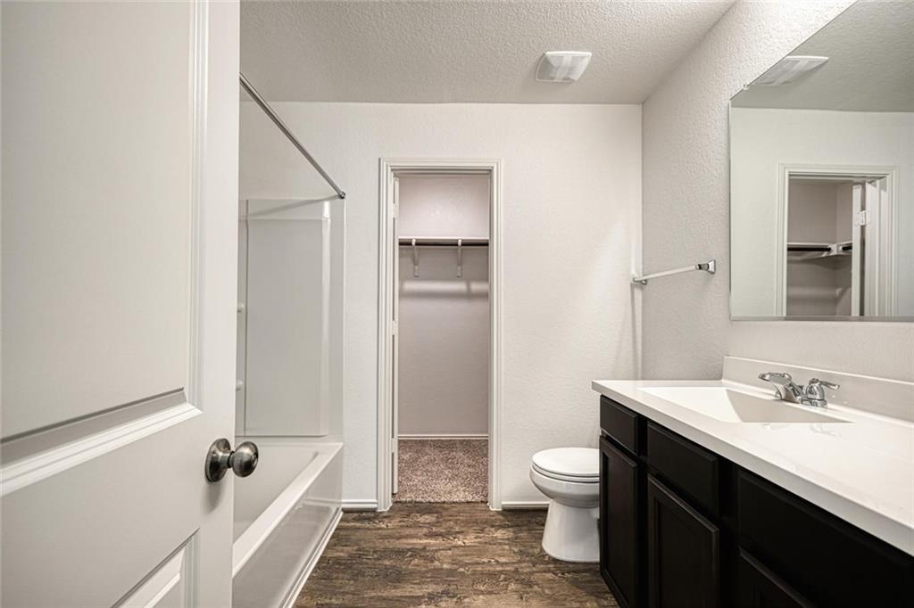 772 Circle Way Jarrell, TX 76537 - Photo 12 of 20 a bathroom with a sink a toilet and shower