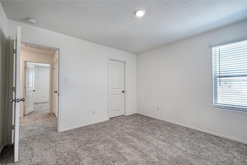 772 Circle Way Jarrell, TX 76537 - Photo 15 of 20 an empty room with windows and closet