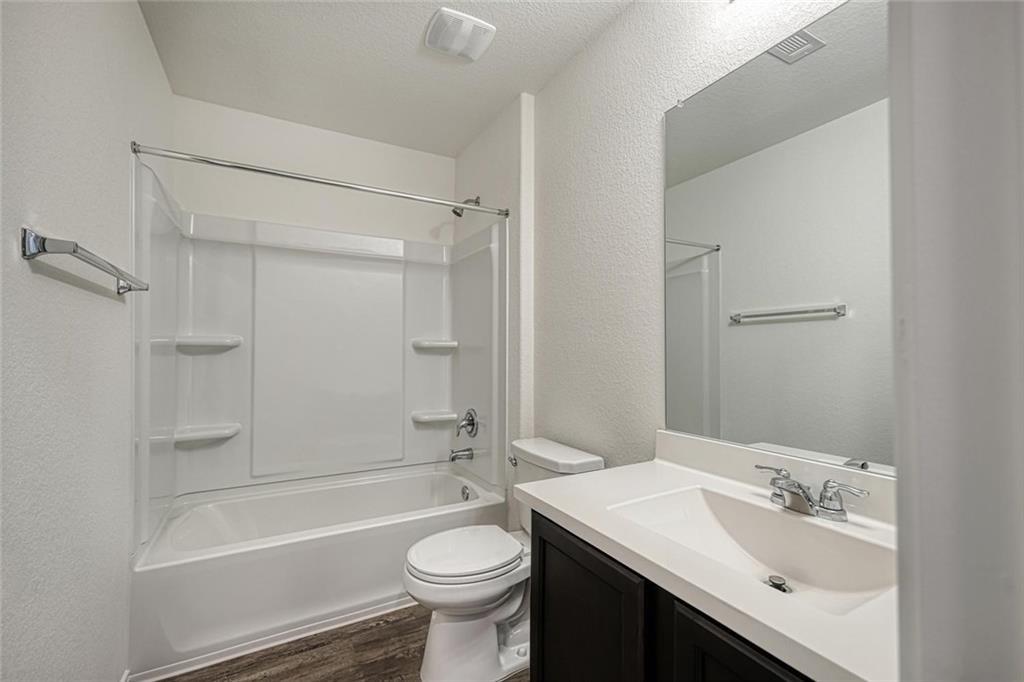 772 Circle Way Jarrell, TX 76537 - Photo 18 of 20 a bathroom with a sink toilet tub and shower