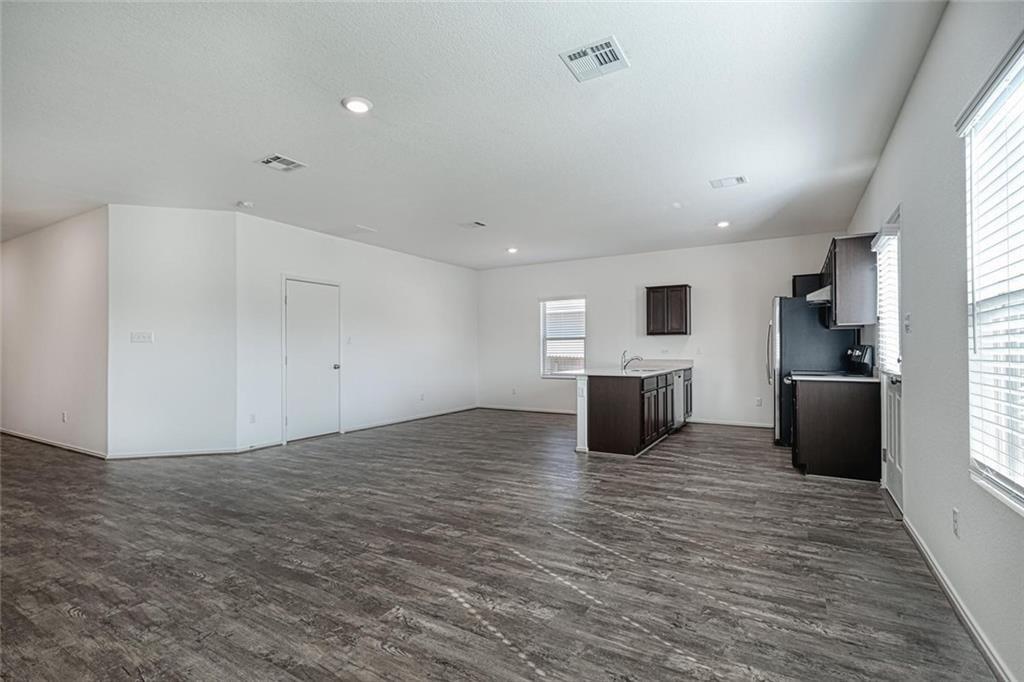 772 Circle Way Jarrell, TX 76537 - Photo 4 of 20 a view of a kitchen with microwave and cabinets