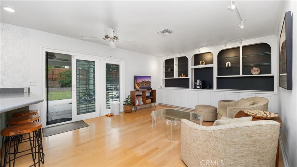 2318 Elsinore Road Riverside, CA 92506 - Photo 17 of 41 a living room with furniture window and flat screen tv