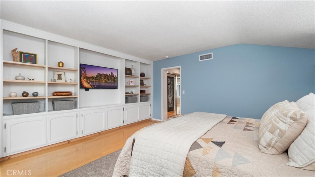 2318 Elsinore Road Riverside, CA 92506 - Photo 20 of 41 a bedroom with a bed and a flat screen tv