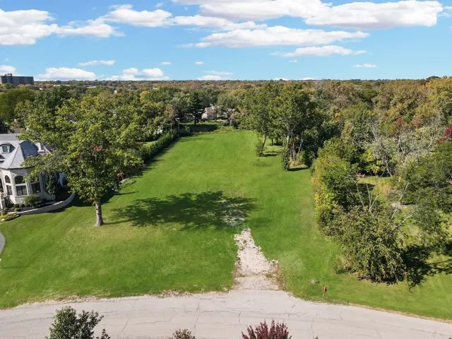 a view of a lake with a yard