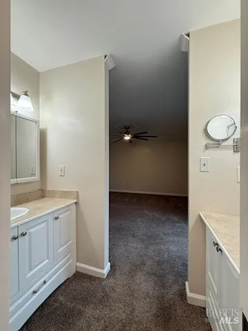 a view of a bathroom with mirror
