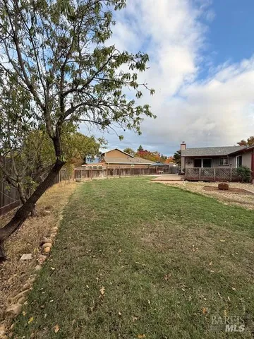 a backyard of a house with lots of green space