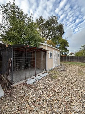a view of a backyard with sitting area