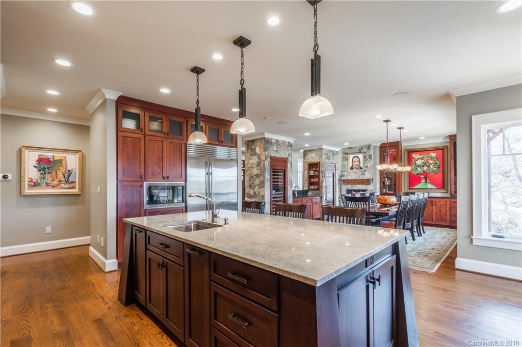 2649 River Ridge Place Fort Mill, SC 29708 - Photo 12 of 34 a kitchen with granite countertop a stove and a sink