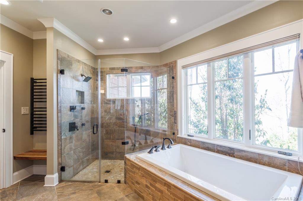 2649 River Ridge Place Fort Mill, SC 29708 - Photo 17 of 34 a spacious bathroom with a tub shower and sink