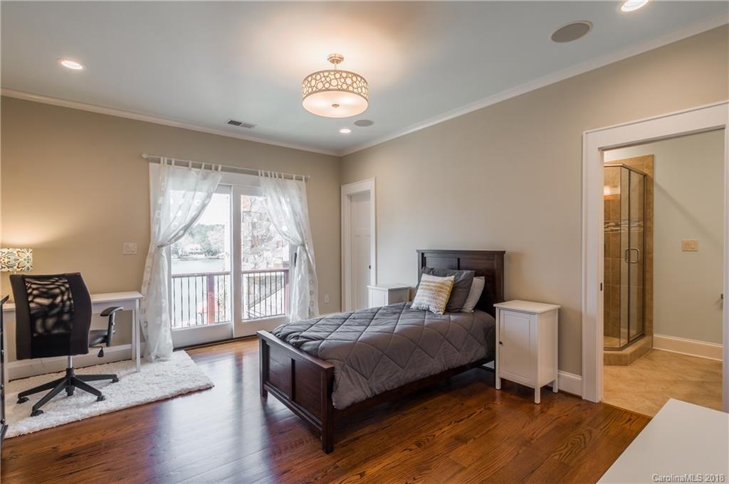 2649 River Ridge Place Fort Mill, SC 29708 - Photo 19 of 34 a bedroom with a bed and wooden floor