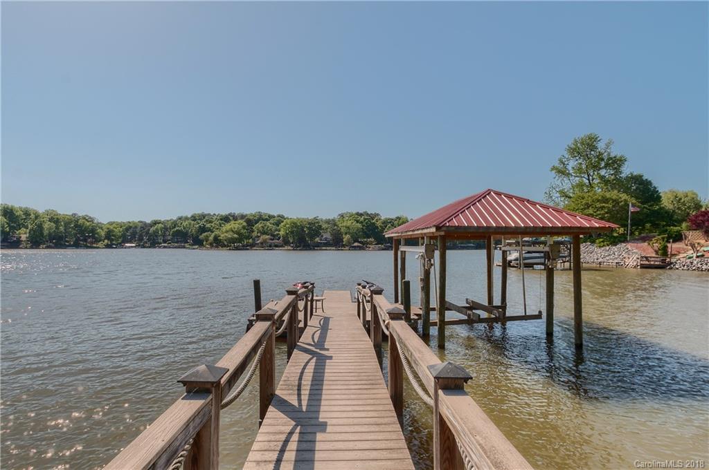 2649 River Ridge Place Fort Mill, SC 29708 - Photo 31 of 34 a view of a lake with wooden deck