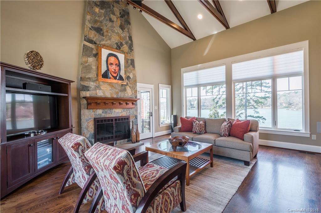 2649 River Ridge Place Fort Mill, SC 29708 - Photo 6 of 34 a living room with fireplace furniture and a flat screen tv