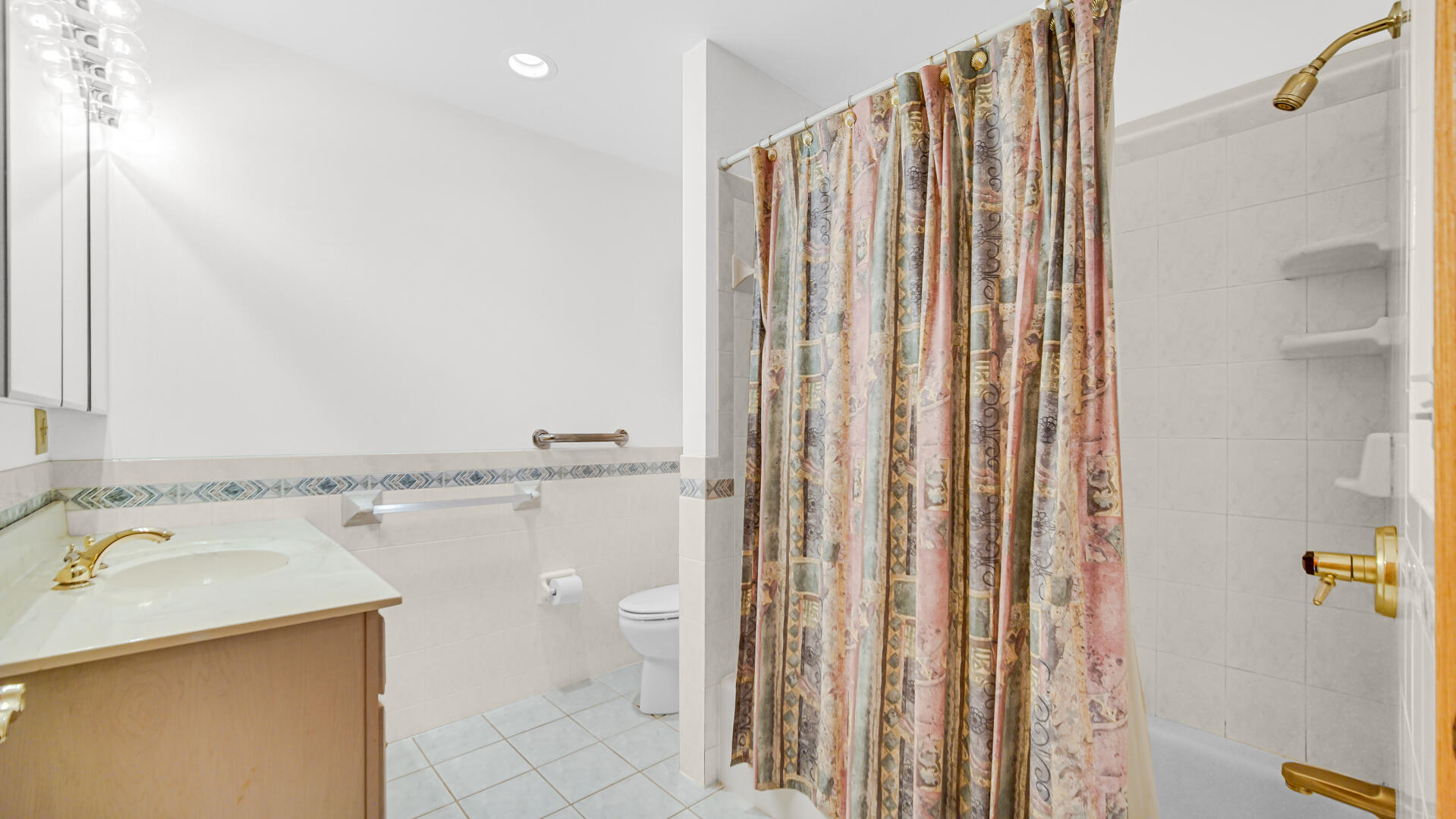 11339 West Snyder Road Westville, IN 46391 - Photo 17 of 27 a bathroom with a shower curtain and a sink