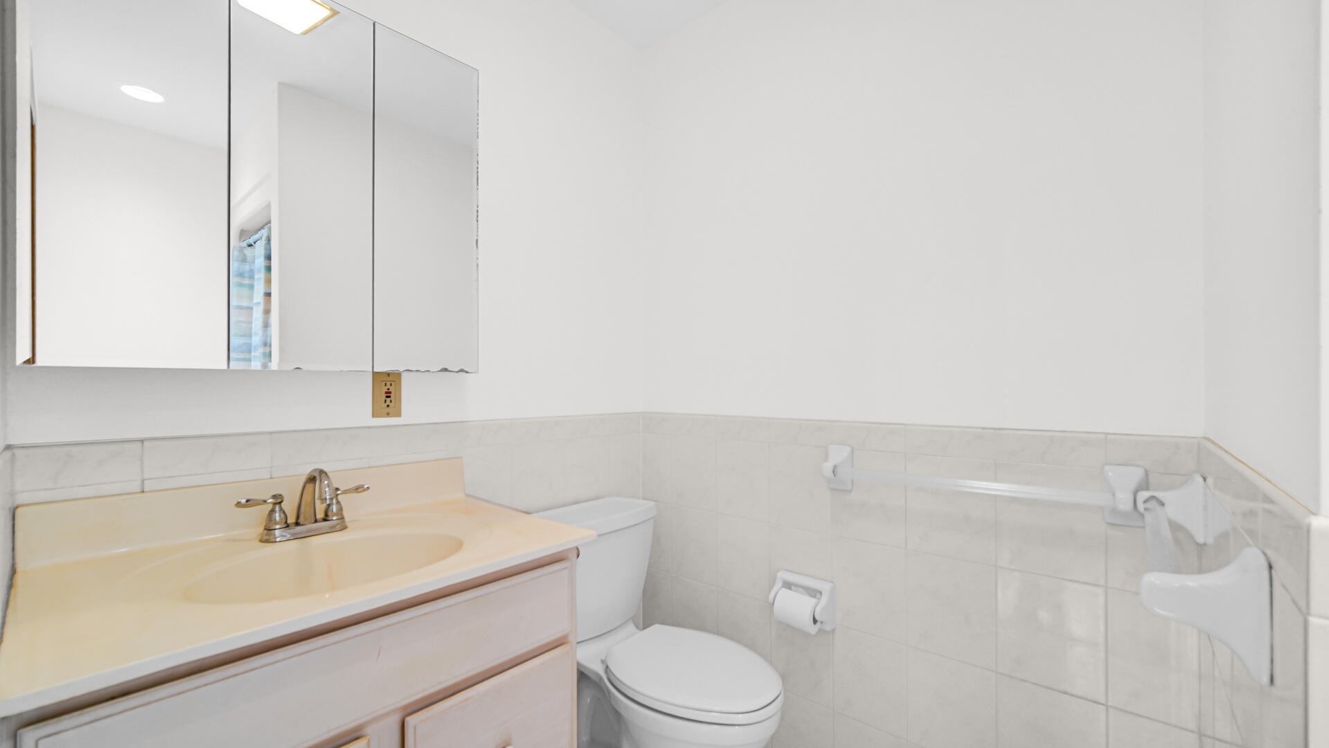 11339 West Snyder Road Westville, IN 46391 - Photo 19 of 27 a bathroom with a sink a toilet and a mirror