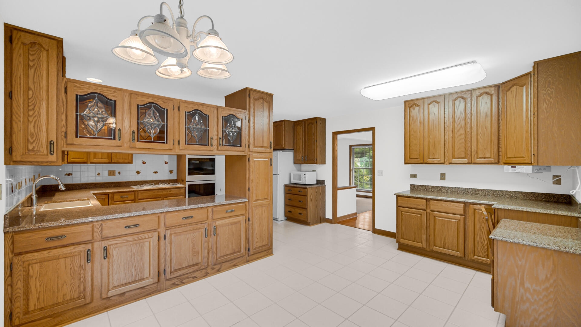 11339 West Snyder Road Westville, IN 46391 - Photo 6 of 27 a kitchen with stainless steel appliances granite countertop a sink dishwasher stove and refrigerator